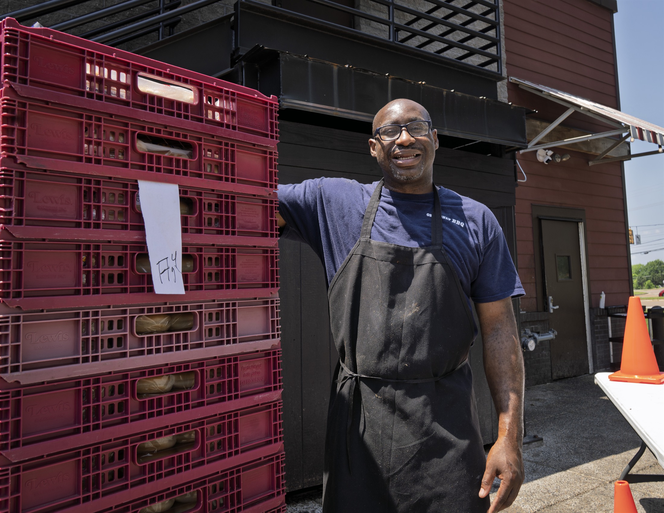 Marco Knox smiling while working outdoors.